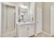 Bathroom featuring a white vanity with a mirror and cabinets, as well as a doorway at 1614 Brussels Drive Dr, Apex, NC 27502