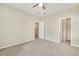 Bedroom with carpet and ceiling fan showing a closet and an attached hallway with doorway at 1614 Brussels Drive Dr, Apex, NC 27502