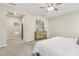 Bedroom featuring a dresser with decorative vases and artwork, as well as an attached hallway and doorway at 1614 Brussels Drive Dr, Apex, NC 27502