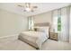 Serene bedroom featuring a neutral color palette and soft textures and lots of natural light at 1614 Brussels Drive Dr, Apex, NC 27502