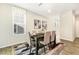 Dining area with a table set for dinner, light walls and luxury vinyl plank flooring at 1614 Brussels Drive Dr, Apex, NC 27502