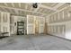Unfinished two-car garage, showcasing ample space and potential for storage or hobbies at 1614 Brussels Drive Dr, Apex, NC 27502