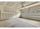 Spacious two-car garage with unfinished walls and ceiling, ready for personalization at 1614 Brussels Drive Dr, Apex, NC 27502