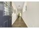 Inviting hallway with wood floors leads to a dining area with natural light at 1614 Brussels Drive Dr, Apex, NC 27502