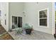 Outdoor patio with comfortable seating, offering a relaxing space adjacent to the home at 1614 Brussels Drive Dr, Apex, NC 27502