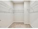 Walk-in closet featuring wire shelving along the walls and carpeted floors at 1614 Brussels Drive Dr, Apex, NC 27502
