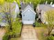 Aerial view of home showcasing the driveway, two-car garage, and fenced backyard at 1640 Legendary Ln, Morrisville, NC 27560