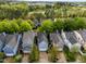 Aerial shot of a neighborhood with manicured lawns and tree-lined streets near the highway at 1640 Legendary Ln, Morrisville, NC 27560