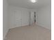 Bright bedroom with neutral carpet, a closet, and an ensuite bathroom at 1640 Legendary Ln, Morrisville, NC 27560