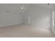 Large bedroom with plush carpet, vaulted ceilings, and bright double-hung windows at 1640 Legendary Ln, Morrisville, NC 27560
