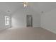 Spacious bedroom featuring neutral carpet, bright natural light and a ceiling fan at 1640 Legendary Ln, Morrisville, NC 27560