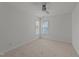 Neutral bedroom featuring plush carpet, a modern ceiling fan, and bright windows at 1640 Legendary Ln, Morrisville, NC 27560