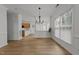 Bright dining room area with hardwood floors and access to the kitchen, great for modern entertaining at 1640 Legendary Ln, Morrisville, NC 27560