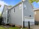 Back exterior view of home with fenced yard and gray siding at 1640 Legendary Ln, Morrisville, NC 27560