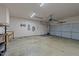 Empty two car garage with shelving and workbench at 1640 Legendary Ln, Morrisville, NC 27560