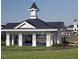 Community gazebo with decorative cupola and white columns on manicured lawn at 1640 Legendary Ln, Morrisville, NC 27560