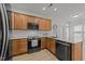 Bright kitchen featuring granite countertops, stainless steel appliances, and wood cabinets for storage at 1640 Legendary Ln, Morrisville, NC 27560