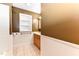 Brown bathroom featuring white wainscoting and vanity at 1744 Prince Edward Dr, Elon, NC 27244