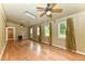 Versatile bonus room with hardwood floors, natural light, and a cozy electric fireplace at 1744 Prince Edward Dr, Elon, NC 27244