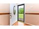 A bright, white front door with a decorative glass window welcomes you into this charming home at 1744 Prince Edward Dr, Elon, NC 27244