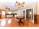 Spacious kitchen offers white cabinets, black counters, dining area and flows into a cozy bonus room at 1744 Prince Edward Dr, Elon, NC 27244