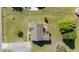Aerial view of house with new roof, deck, long driveway, and large yard surrounded by trees at 20 Sanders Rd, Benson, NC 27504