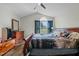 Spacious bedroom featuring vaulted ceilings, dark wood furnishings, and ample natural light at 20 Sanders Rd, Benson, NC 27504