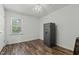 Bedroom with hardwood floors and a secure safe for valuables at 20 Sanders Rd, Benson, NC 27504