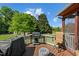 View from deck with grill, seating, and a spacious backyard perfect for outdoor activities at 20 Sanders Rd, Benson, NC 27504