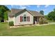 Charming single-story home with tidy landscaping, red shutters, and inviting front porch at 20 Sanders Rd, Benson, NC 27504