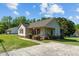 Charming single-story home with a well-manicured lawn and a welcoming front porch at 20 Sanders Rd, Benson, NC 27504