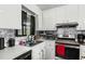 Bright kitchen featuring stainless steel sink, modern faucet, and sleek countertops at 20 Sanders Rd, Benson, NC 27504