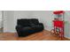 Comfortable living room features a plush couch and charming popcorn machine at 20 Sanders Rd, Benson, NC 27504
