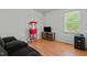 Cozy living room with popcorn machine, tv, and comfortable couch at 20 Sanders Rd, Benson, NC 27504