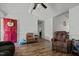 Open-concept living room with durable wood flooring and a comfortable seating arrangement at 20 Sanders Rd, Benson, NC 27504
