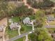 Expansive aerial view showcasing a luxury home, pool, and well-manicured lawns in a desirable neighborhood at 2000 Silverleaf Dr, Youngsville, NC 27596