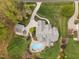 A captivating aerial view reveals an expansive estate, highlighting the home and serene pool area at 2000 Silverleaf Dr, Youngsville, NC 27596