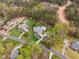 Spacious estate featuring a large home, a swimming pool, surrounded by lush landscaping and trees at 2000 Silverleaf Dr, Youngsville, NC 27596
