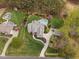 A bird's-eye view of the sprawling estate features a home, pristine pool, and lush green surroundings at 2000 Silverleaf Dr, Youngsville, NC 27596