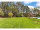 Scenic backyard with a mature tree line, creating a private oasis at 2000 Silverleaf Dr, Youngsville, NC 27596