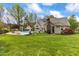 Spacious backyard featuring a pool, detached garage and mature trees at 2000 Silverleaf Dr, Youngsville, NC 27596