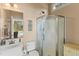 Functional bathroom with a glass-enclosed shower, white vanity, and natural light at 2000 Silverleaf Dr, Youngsville, NC 27596