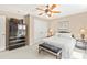 Inviting bedroom featuring a comfortable bed, and a modern dresser, illuminated by soft lamps and overhead lighting at 2000 Silverleaf Dr, Youngsville, NC 27596