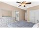 Cozy bedroom with dresser and view into adjoining bathroom at 2000 Silverleaf Dr, Youngsville, NC 27596