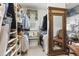 Spacious walk-in closet with custom shelving, bench, and full-length mirror at 2000 Silverleaf Dr, Youngsville, NC 27596