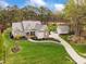 Charming exterior of a home with stone accents, a well-maintained lawn, and an inviting driveway at 2000 Silverleaf Dr, Youngsville, NC 27596