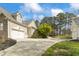 Charming home features a two-car garage and beautiful landscaping at 2000 Silverleaf Dr, Youngsville, NC 27596