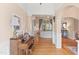 Spacious foyer with hardwood flooring and arched openings to the living spaces, showcasing architectural detail at 2000 Silverleaf Dr, Youngsville, NC 27596