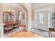 Inviting foyer area with hardwood flooring flowing seamlessly into the adjacent dining space at 2000 Silverleaf Dr, Youngsville, NC 27596