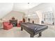 Recreational game room with a pool table, cozy chairs, an electric fireplace and natural light coming through the window at 2000 Silverleaf Dr, Youngsville, NC 27596